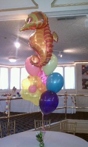 Jumbo mylar fish with 5 11inch balloons and blossom